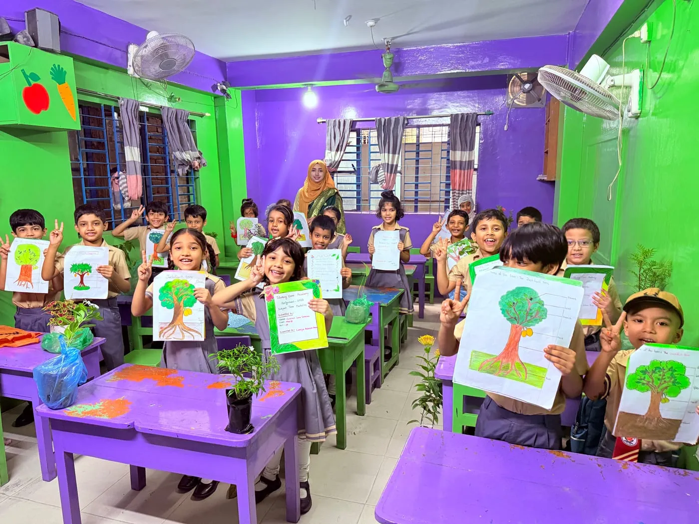 Care Academy students displaying their artwork in class